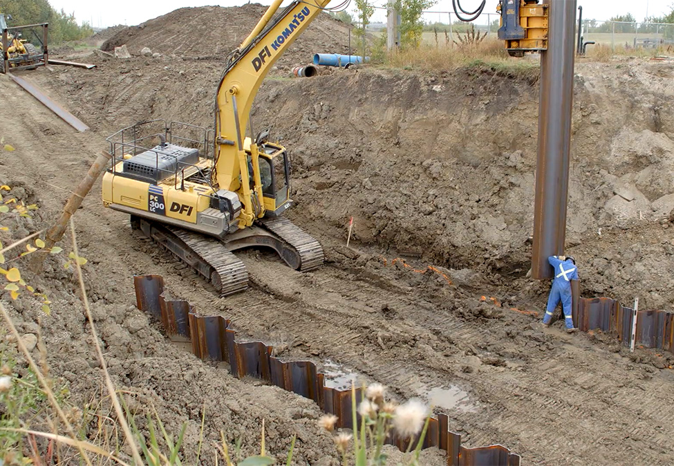 Worker Guiding Sheet Piling